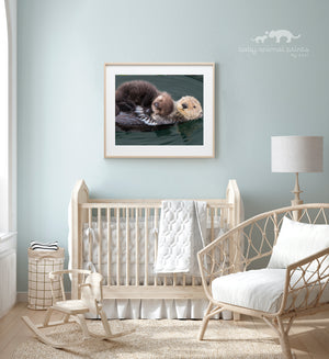 Baby Sea Otter Snuggled on Mom Photo